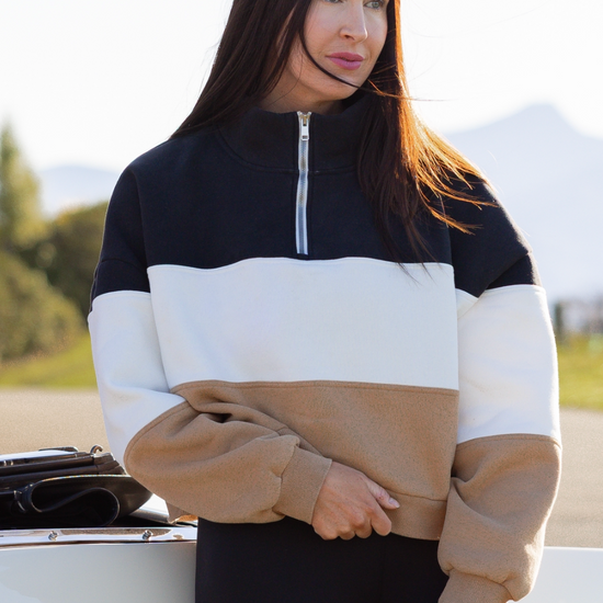 old money paneled over sized sweater on a vintage car background 