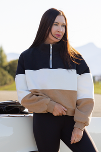 old money paneled over sized sweater on a vintage car background 