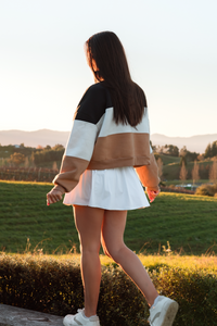 old money paneled over sized sweater and white pleat skirt