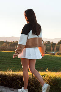 old money paneled over sized sweater and white pleat skirt