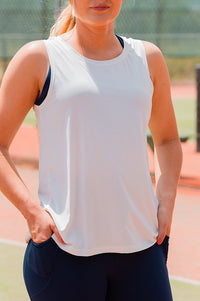 Women wearing a white sleeveless singlet.