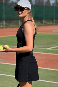 Women wearing black tennis skort.