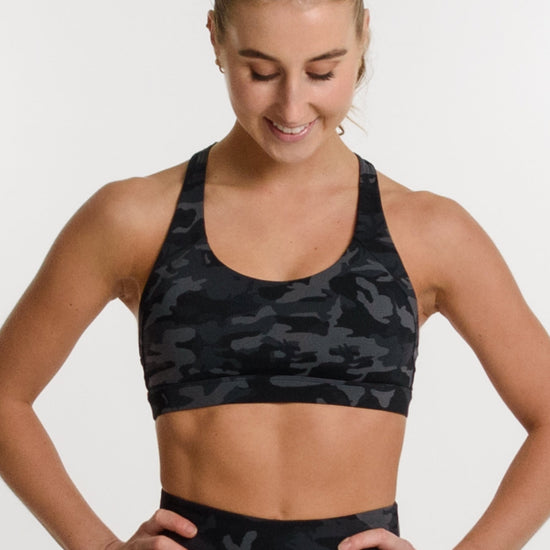 Women wearing camo matching bra and shorts