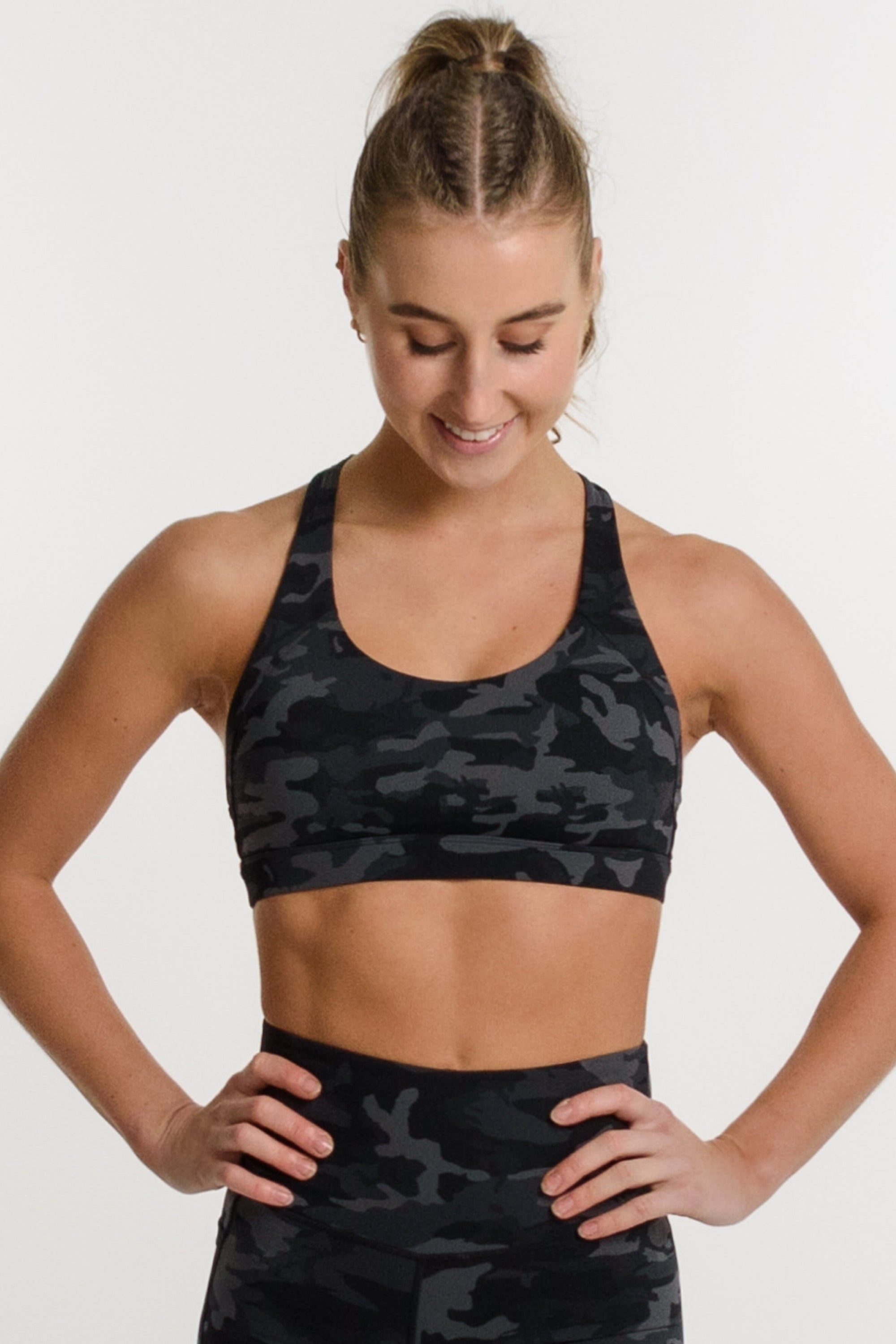 Women wearing camo matching bra and shorts