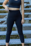 women wearing black 7/8 leggings. High Waist and Phone pockets