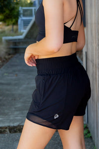 Women wearing black gym shorts