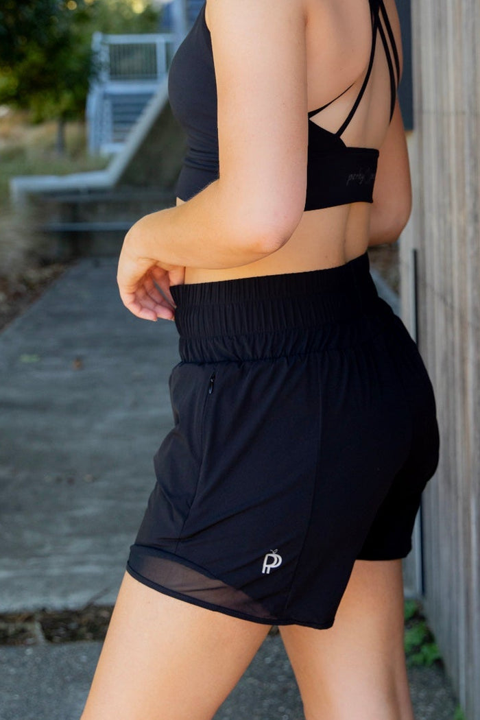 Women wearing black gym shorts