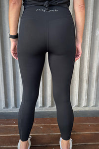 women wearing black squat proof non roll down leggings.