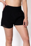 Women wearing black walking shorts