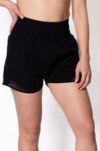 Women wearing black walking shorts