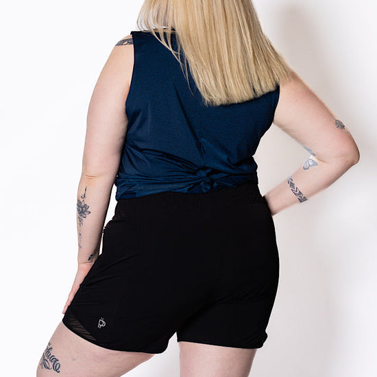 Curvy women wearing black walking shorts