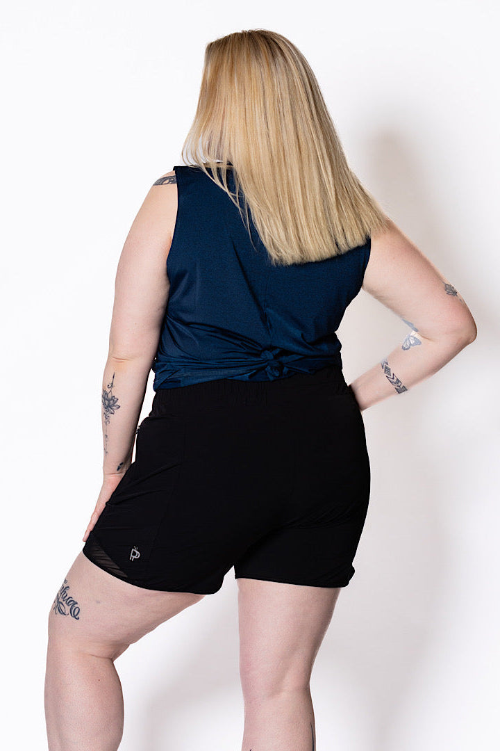 Curvy women wearing black walking shorts