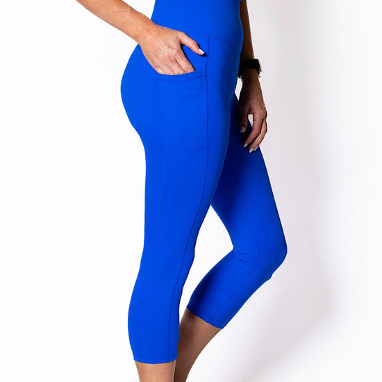 women wearing electric blue phone pocket leggings