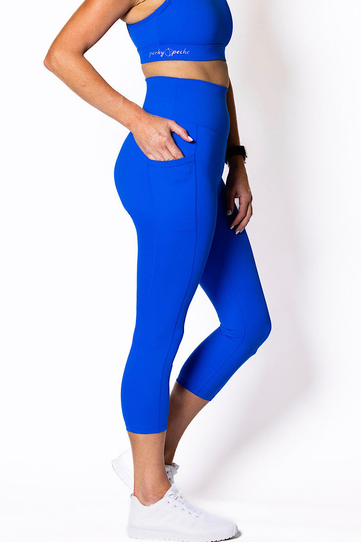 women wearing electric blue phone pocket leggings