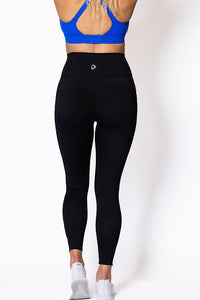 Women wearing high waist phone pocket tights with blue sports bra 