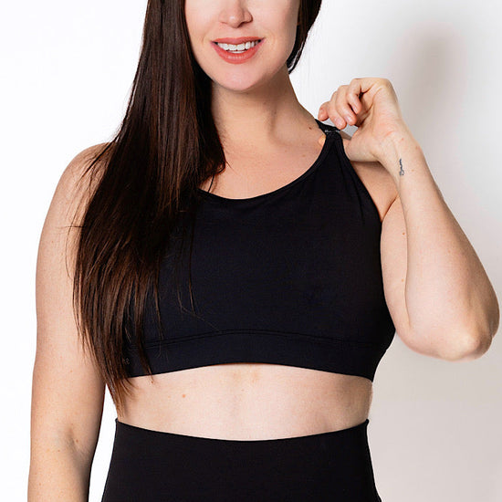 Women wearing a black breast-feeding sports bra
