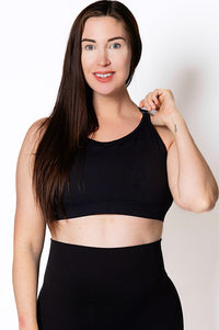 Women wearing a black breast-feeding sports bra