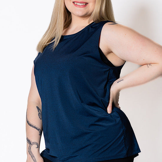 Woman wearing a blue sleeveless tank
