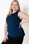 Woman wearing a blue sleeveless tank