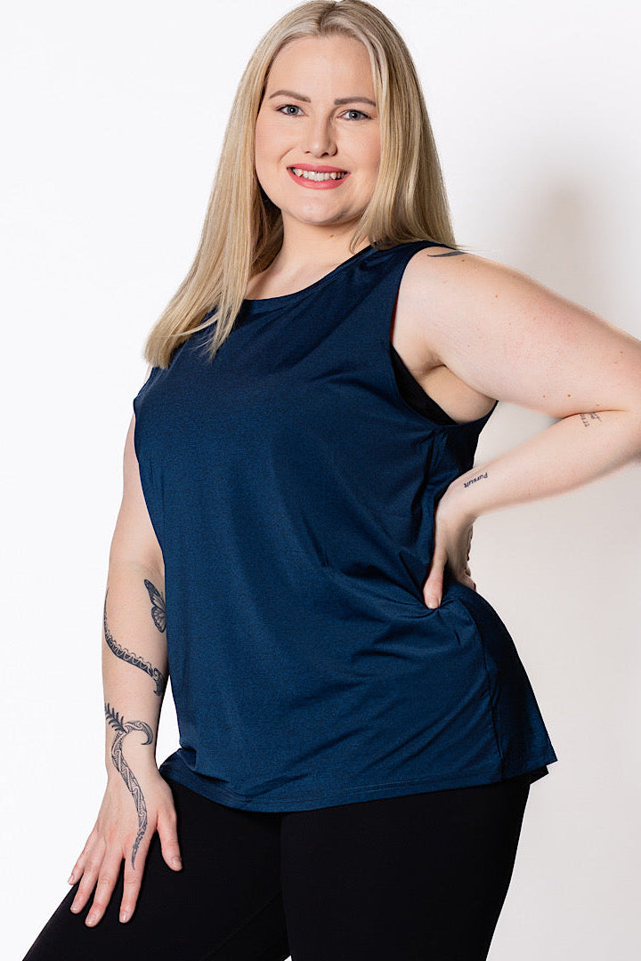 Woman wearing a blue sleeveless tank