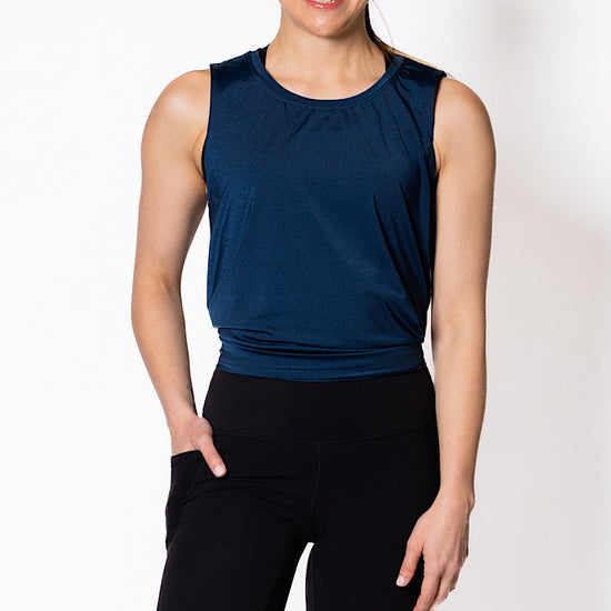 Woman wearing a blue sleeveless tank