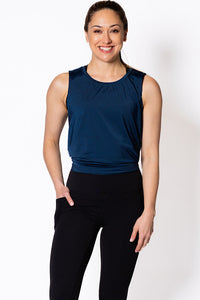 Woman wearing a blue sleeveless tank