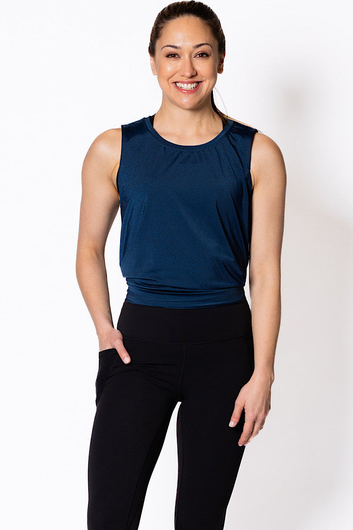 Woman wearing a blue sleeveless tank