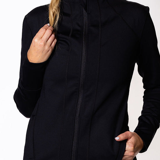 Woman wearing a black zip jacket