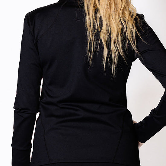 Woman wearing a black zip jacket