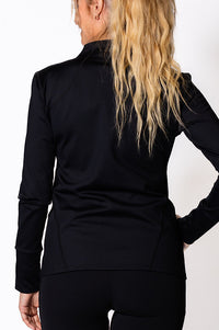 Woman wearing a black zip jacket