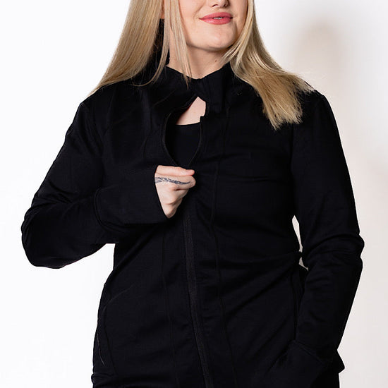 Woman wearing a black zip jacket