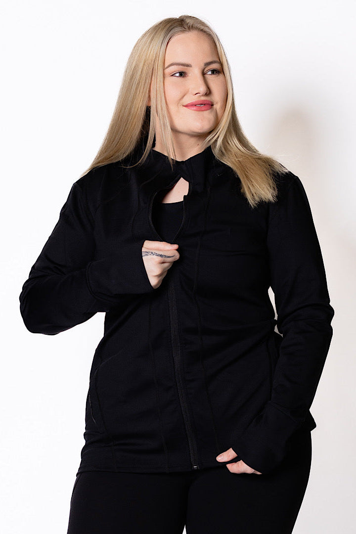 Woman wearing a black zip jacket