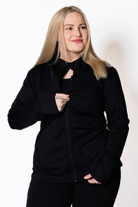 Woman wearing a black zip jacket