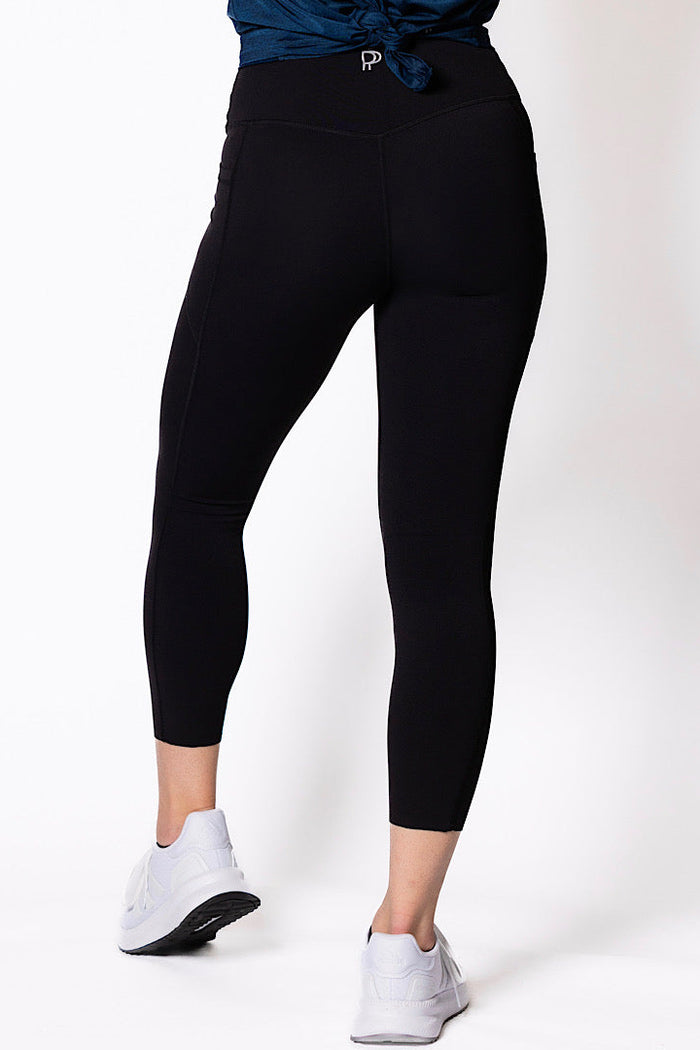 women wearing black 7/8 high waist phone pocket tights