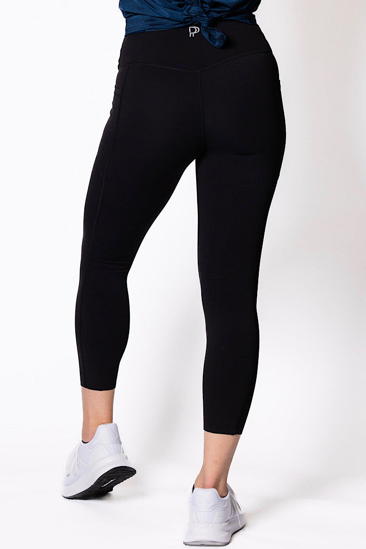 women wearing black 7/8 high waist phone pocket tights