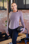 Women wearing long sleeve exercise top
