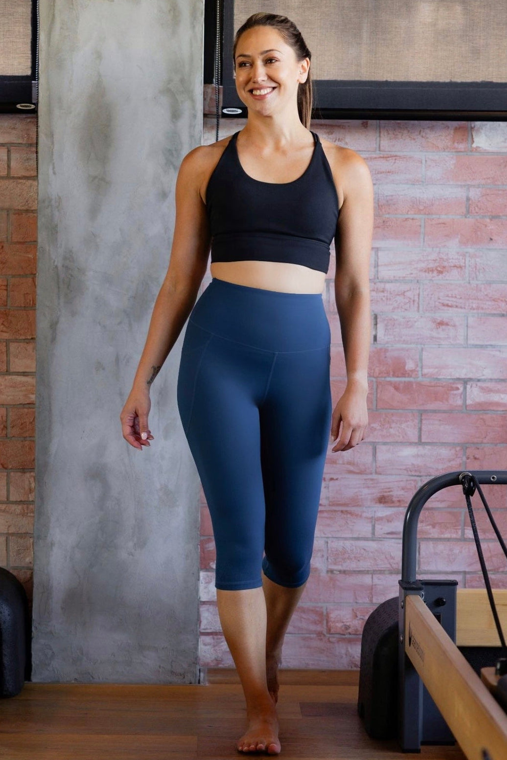 Women wearing capri phone pocket tights