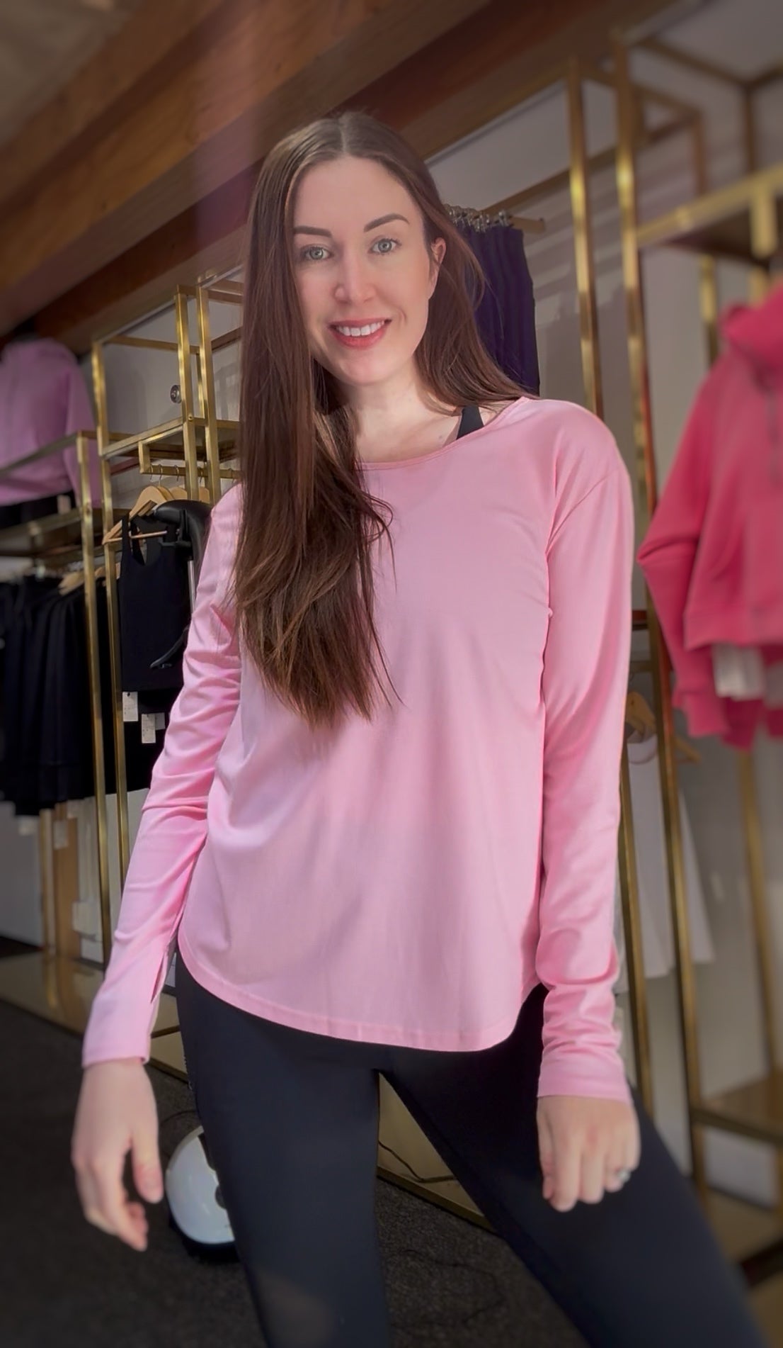 woman wearing a pink long-sleeve top 
