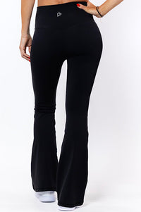 women wearing high waist black flared tights 