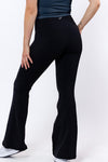 women wearing high waist black flared tights 