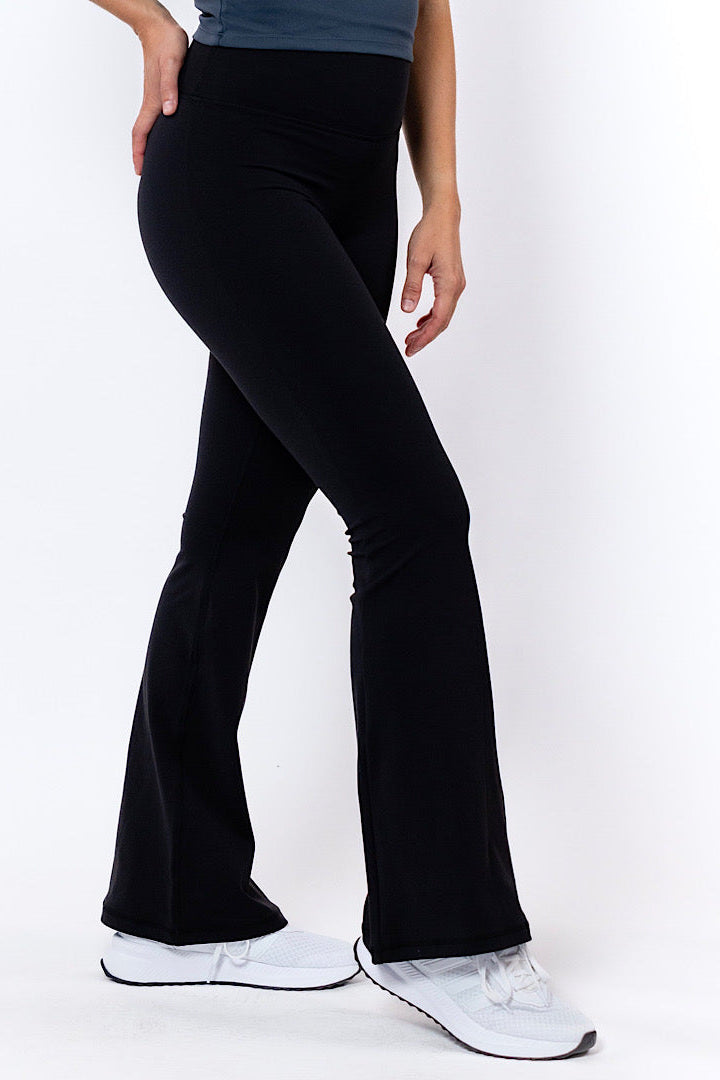 women wearing comfy black flared tights 