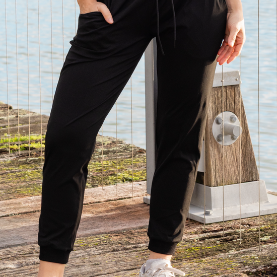 Woman wearing black walking pants