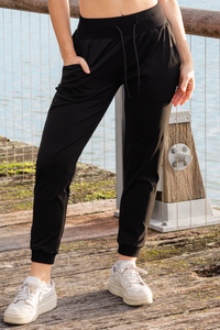 Woman wearing black walking pants