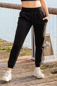 Woman wearing black athletic pants with pockets