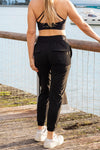 Woman wearing black travel pants