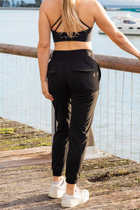 Woman wearing black travel pants