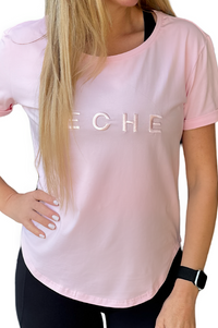 Women wearing pink scoop neck t-shirt