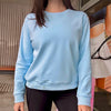 Women wearing a light blue cotton sweatshirt.
