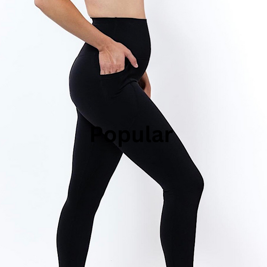 Women wearing high waisted black phone pocket tights and a navy bra
