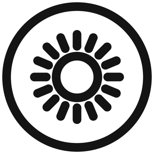 A minimalist black circular sun icon with a central circle and radiating petal-like segments, shown on a plain white background.